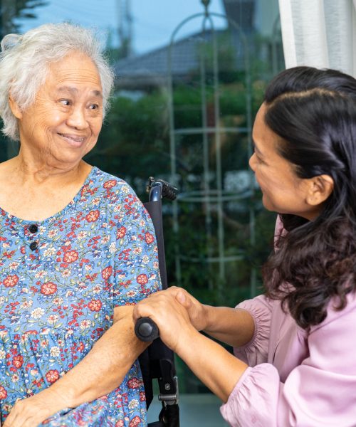 Caregiver help Asian senior woman on wheelchair with love at hom Caregiver help Asian senior woman on wheelchair with love at home.